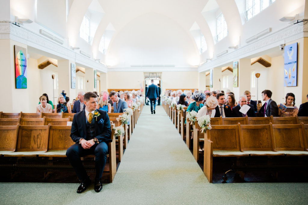 groom waits at church