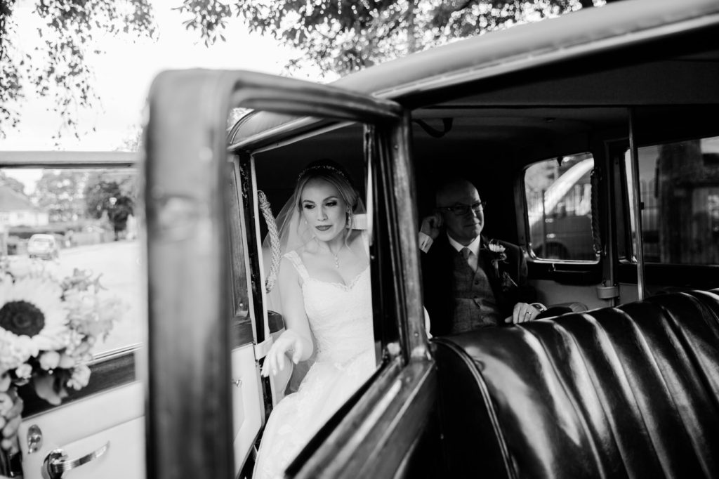 bride leaving car arriving at wedding