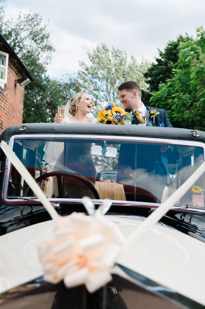 bride and groom fun car photo